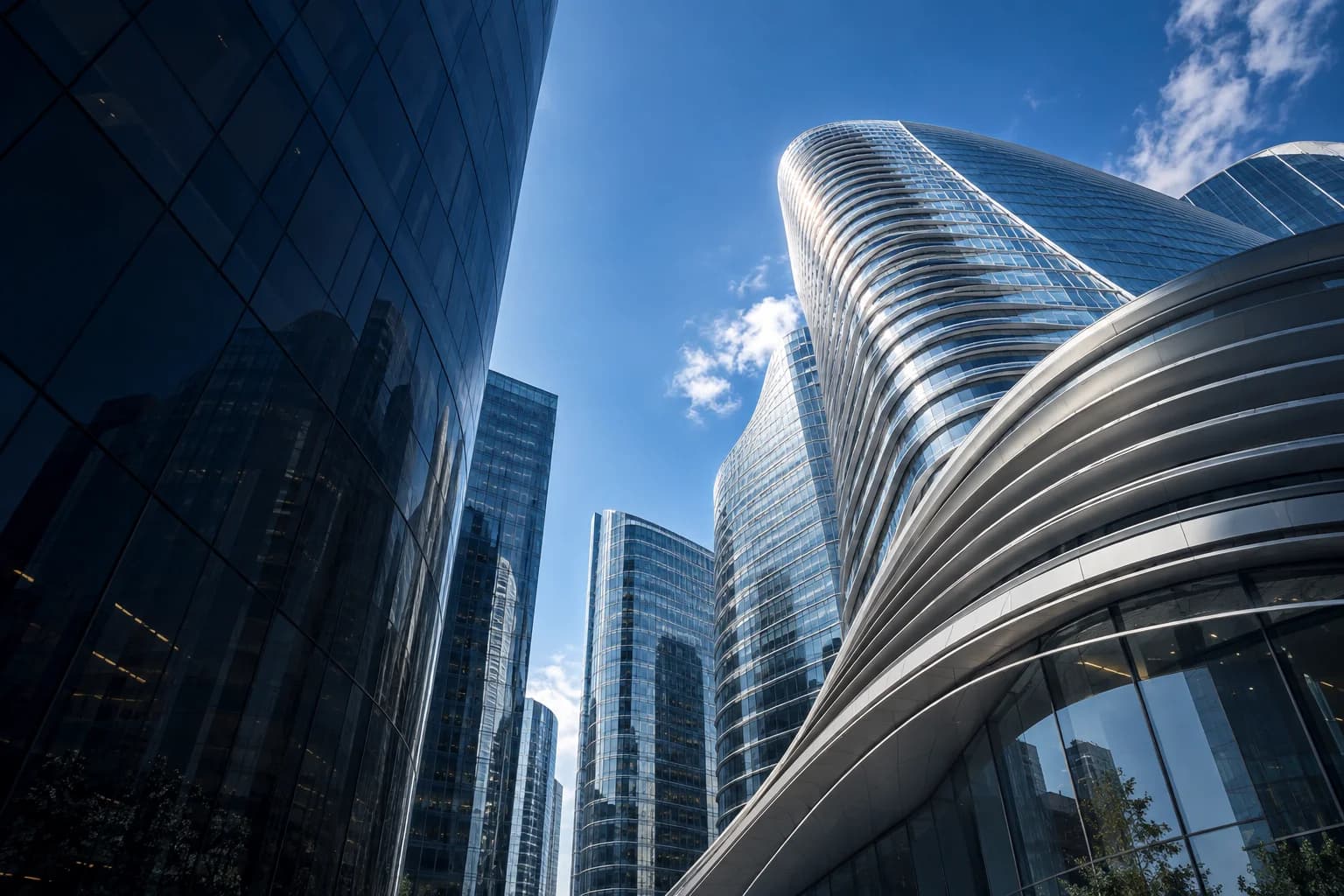 Sculptural glass architecture reaching into a blue sky